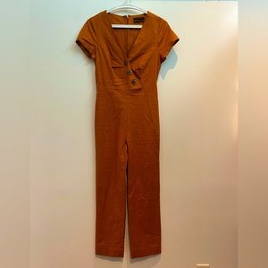 Urban Outfitters short sleeved fitted jumpsuit. Size small, copper color.